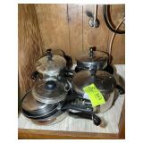 CONTENTS OF LEFT SIDE OF CABINET UNDER SINK, POTS