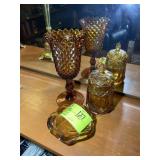 GROUP OF AMBER GLASS DISHES, CANDY JAR, VASE, UP T
