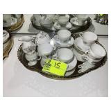 TEA SET INCLUDING, SAUCERS, CUPS, CREAM AND SUGAR