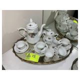 TEA SET INCLUDING, SAUCERS, CUPS, PITCHER, ETC