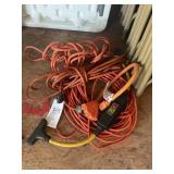 GROUP OF ORANGE EXTENSION CORDS AND SPLITTERS