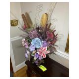 DECORATIVE FLORAL ARRANGEMENT IN FOOTED PLANTER, A