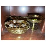 GROUP INCLUDING BRASS COLOR DECORATIVE ITEMS, FOOT