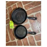 PAIR OF CAST IRON FRYING PANS, SMALL ONE MARKED NO