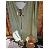 Torch lamp and wicker garbage can