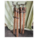 Four antique wood table clamps