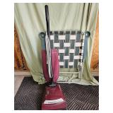 Vacuum sweeper and folding lawn chair