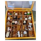Glass top display case loaded with vintage Avon