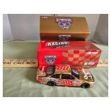 Action racing Dale Jarrett number 88 gold car