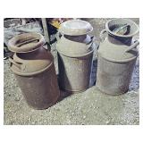 Three vintage milk cans
