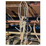 Jumper cables and pipe wrench