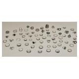 LOT OF SILVERTONE RINGS VARIOUS SIZE & DESIGN