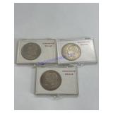 Three 1971 Eisenhower dollars in cases