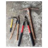 Assorted Gardening Tools Including Picks and Loppers