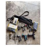 Assorted Hose Nozzles, Straps, Yellow Metal Pieces, and Children's Poncho
