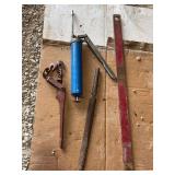 Lot of Assorted Tools including a Grease Gun, Hook Tool, Rasp, and Metal Bar