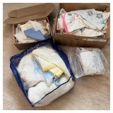 Large assortment of hand stitched linens table