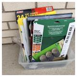 Tote of miscellaneous sandpaper