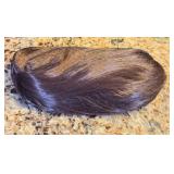 Dark Brown Wig unsure if its real, we think it is