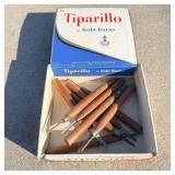 Old cigar box filled with vintage wood chisels