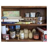 2 shelves of miscellaneous candles