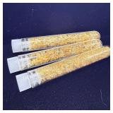 Three vials of gold foil