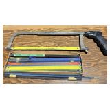 Box of New Hacksaw Blades and Hacksaw