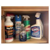 Shelf full of new and used cleaning products
