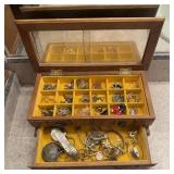 Vintage wooden jewelry box filled with jewelry