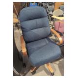 Vintage rolling wooden arm office chair Rip in