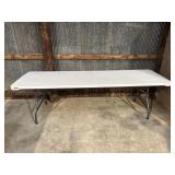 8 foot plastic folding table. Legs do not snap