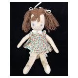 vintage handmade cloth rag doll featuring brown