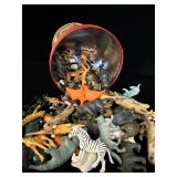 Circus tin filled with vintage plastic animals