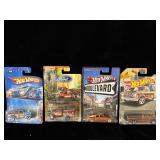 (4) 1:64 scale hot wheels and matchbox cars,