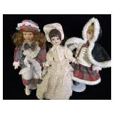 three vintage porcelain collector dolls dressed