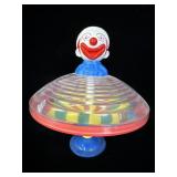 Vintage CLOWN HEAD PLUNGER Spinning Top BATTERY