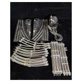 vintage tubular metal model train tracks, likely