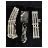 vintage tubular metal model train tracks, likely