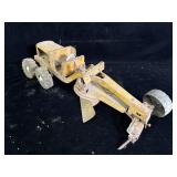 vintage pressed steel toy road grader, resembling