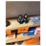Pair of vintage cast iron Amish figures on bench