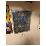 Lot of 19 Eisenhower silver dollars in frame