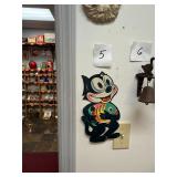 Vintage Felix the Cat holding a fish sign