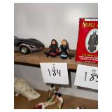 Pair of vintage cast iron Amish women on bench