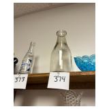 Antique embossed 1 quart milk bottle