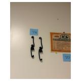 Pair of antique cast iron monkey hooks