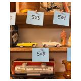 Pair of vintage die cast pedal cars