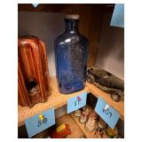 Antique cobalt blue milk of magnesia bottle