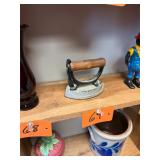 Unique cast iron wooden handled iron