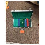 Vintage metal suitcase full of poker chips