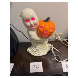 Vintage Ghost Holding Pumpkin Ceramic Figure